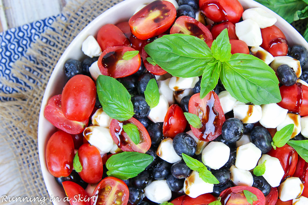 Overhead shot of Blueberry Caprese Salad with basil on top.