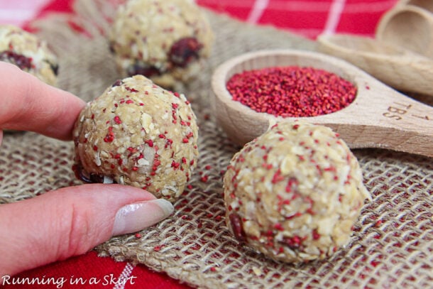 Cranberry Oatmeal Energy Bites With Cranberry Seeds Running In A Skirt