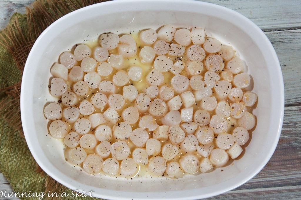 Bay Scallops recipe process photo showing how to put them in the dish for broiling.