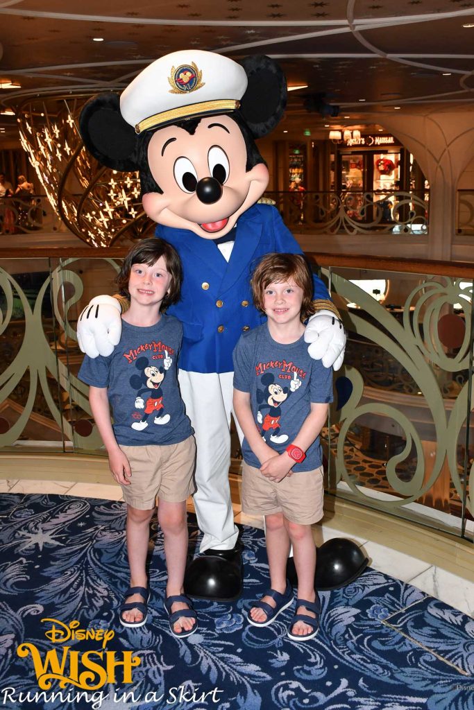 Kids meeting Mickey on Disney Cruise.