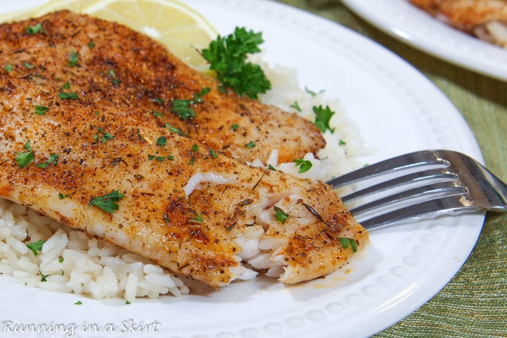 Air Fryer Tilapia flaking with a fork.