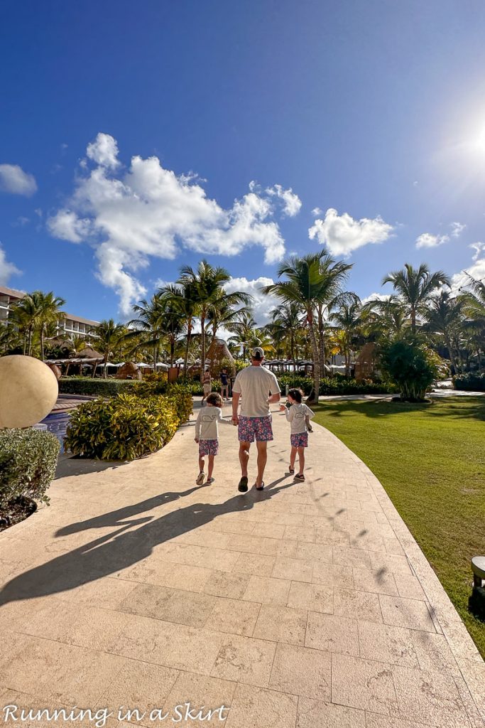 Hyatt Ziva Cap Cana grounds with family walking.